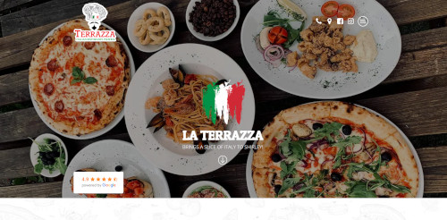 An overhead view of a dining table with various dishes, including pizza, pasta, and salad, presented on white plates. The restaurant logo 'LA TERRAZZA' is visible, along with Italian flag colors.