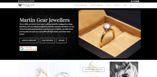 A close-up image of a diamond engagement ring in a box, with a gold band and a large diamond. The background features a black patterned design, indicating a luxurious jewelry store.