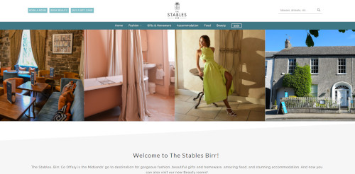 A website screenshot for 'The Stables Birr,' showcasing a warm interior with cozy seating, a woman in a green dress posing, and a modern building exterior. Features sections for fashion, gifts, accommodation, and more.